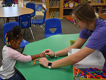 Student building block tower