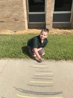 Another Student drawing with chalk